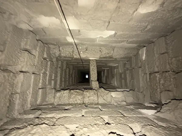 Same smoke chamber interior after resurfacing with a continuous light-colored surface